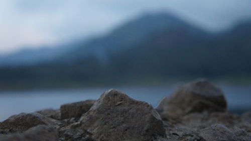 Close-up of rocks against sky