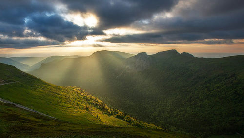 Scenic view of mountains against dramatic sky