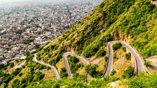 High angle view of road amidst trees in city