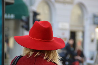 Rear view of woman with red hat