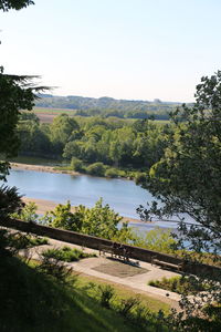 Scenic view of river amidst trees against clear sky