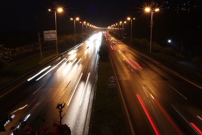 High angle view of light trails on road at night