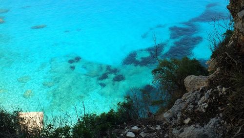 High angle view of sea against blue sky