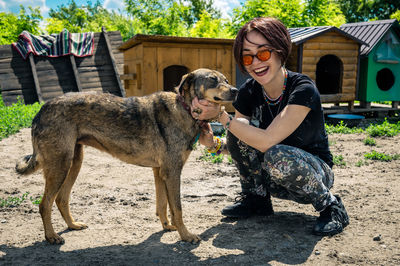 Dog at the shelter. animal shelter volunteer feeding the dogs.