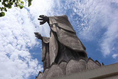 Low angle view of statue against sky