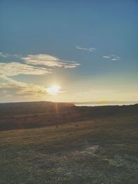 Scenic view of landscape at sunset