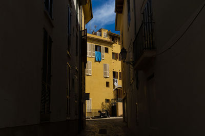 Alley amidst buildings in city