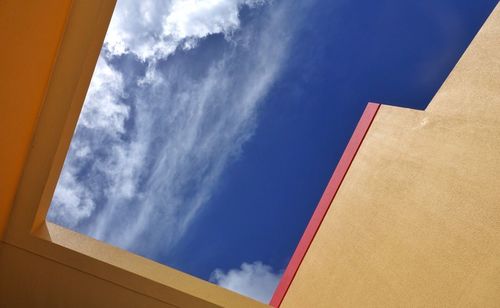 Low angle view of building against blue sky