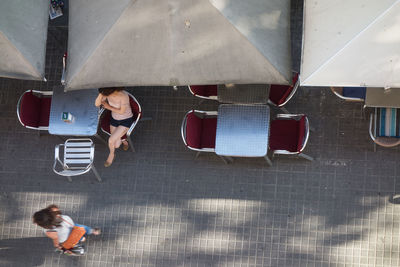 High angle view of women at sidewalk cafe in city