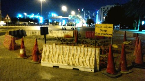 Information sign for sale at night