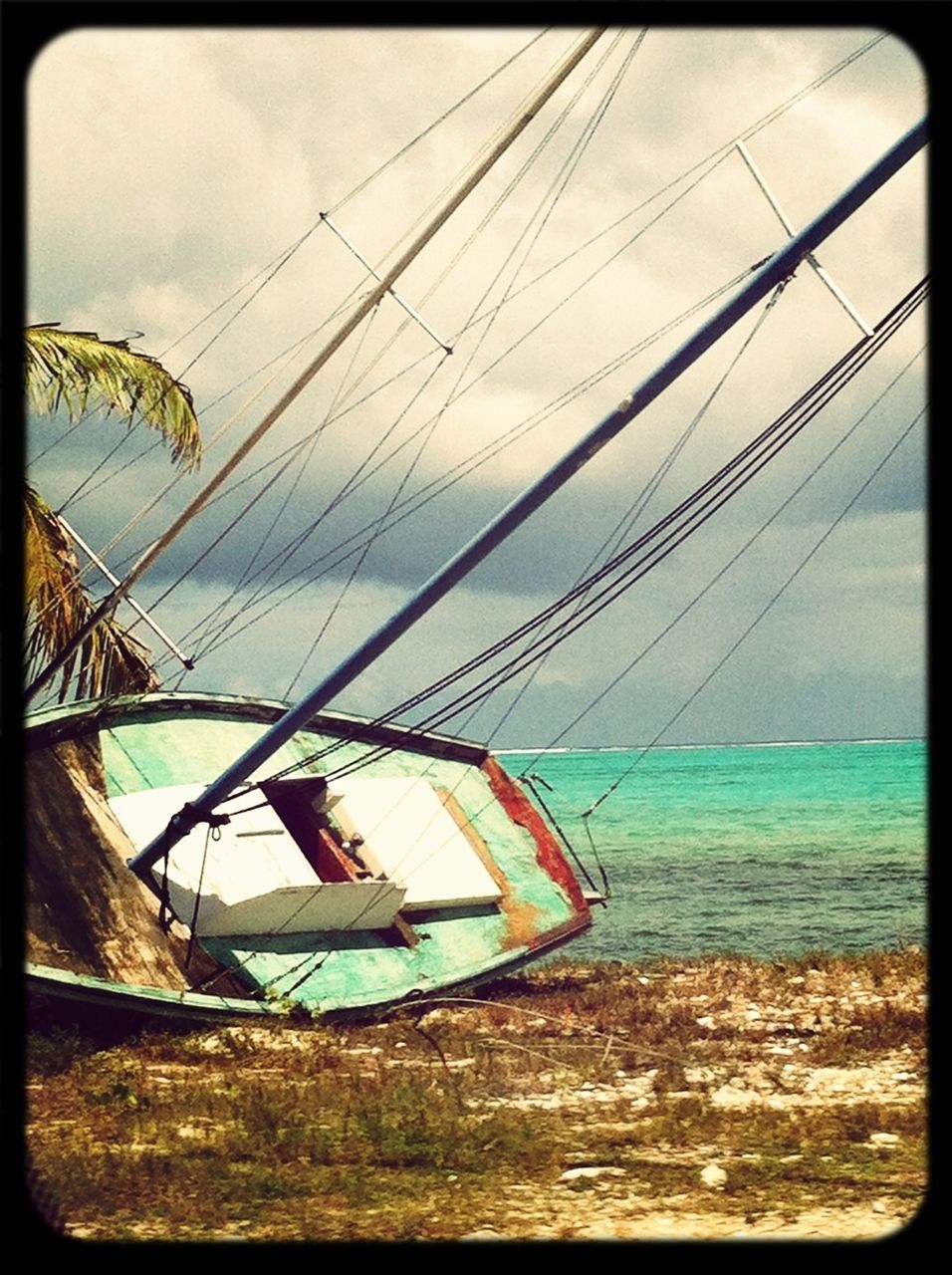 transfer print, sky, auto post production filter, water, nautical vessel, sea, boat, transportation, beach, rope, cloud, cloud - sky, horizon over water, day, nature, moored, outdoors, blue, tranquility, shore