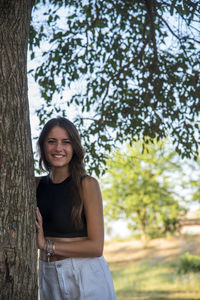 Beautiful italian girl at the park, wearing a dress