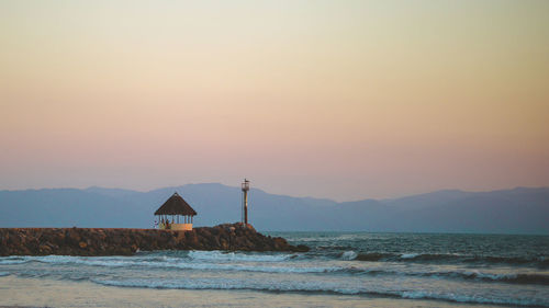 Scenic view of sea against sky during sunset