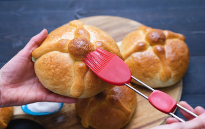 Close-up of hand holding burger