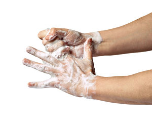 Close-up of human hand against white background