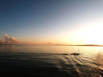 Scenic view of sea against sky at sunset