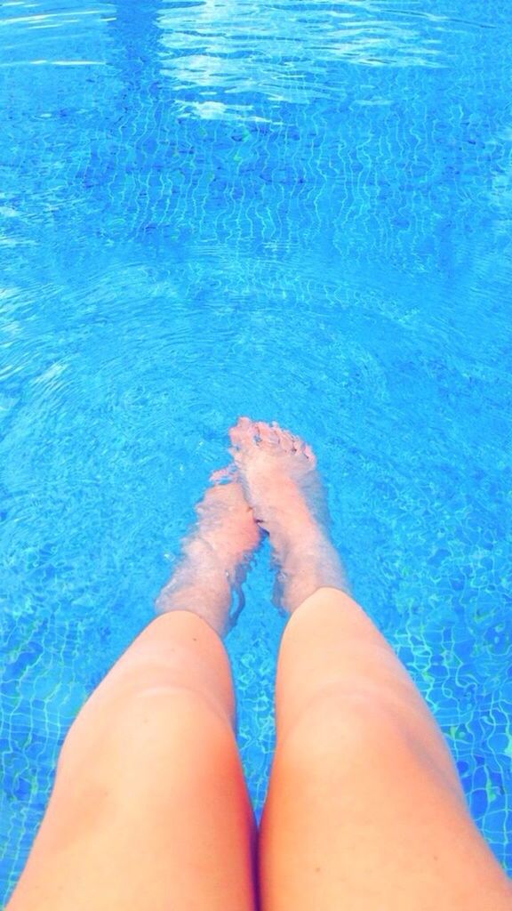 person, low section, personal perspective, water, barefoot, blue, human foot, lifestyles, swimming pool, leisure activity, sea, high angle view, relaxation, part of, vacations, turquoise colored