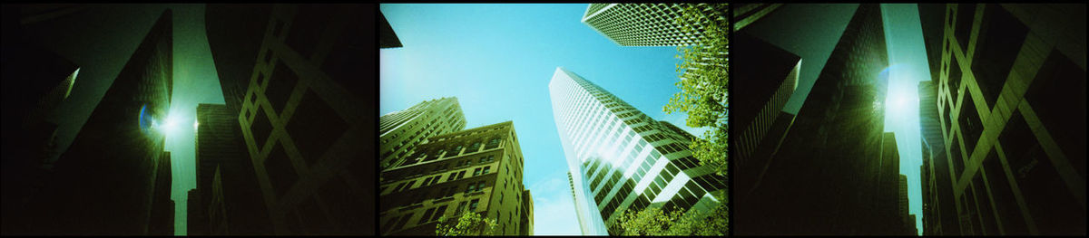 Low angle view of modern skyscrapers against sky