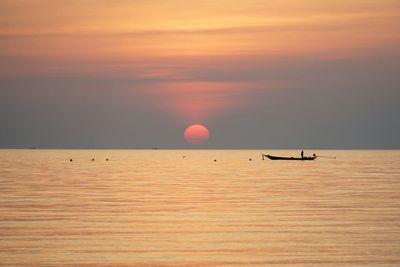 Scenic view of sea at sunset