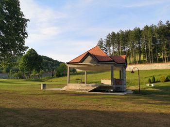 House on field against sky