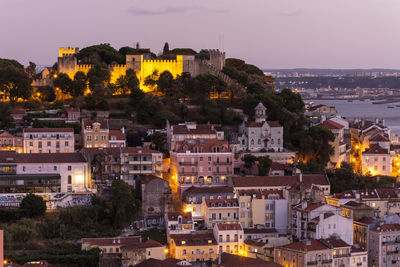 Beautiful view to old historic city buildings and castle during sunset