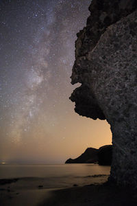 Scenic view of sea against sky at night