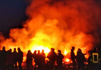 Silhouette of people at night