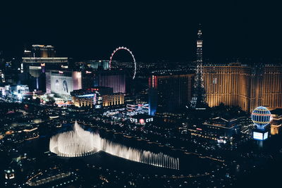 Illuminated buildings in city at night