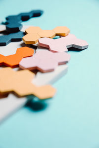 Close-up of jigsaw puzzle on blue background