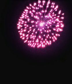 Close-up of illuminated firework display at night