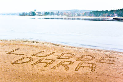 Text on sand at beach
