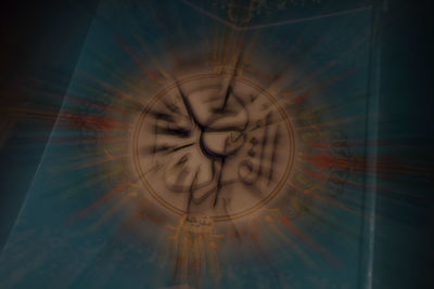 Digital composite image of illuminated clock