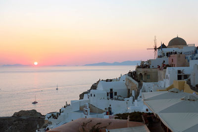 Panoramic view of buildings against sky during sunset