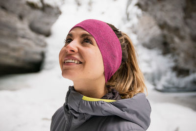 Female hiker enjoys snowy johnston canyon close up