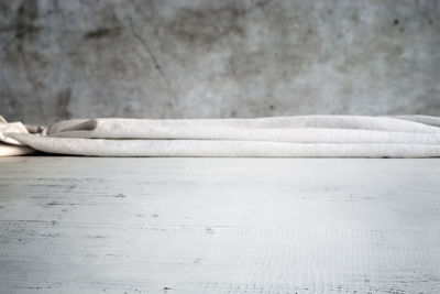 Close-up of white textile on table