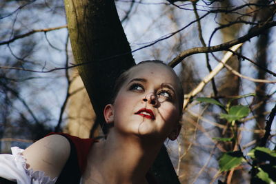 Close-up of thoughtful woman in forest