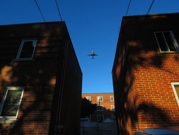 Low angle view of buildings against blue sky