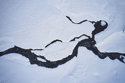 Frozen river in mountainous area in winter