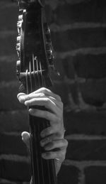 Cropped hands of people playing guitar