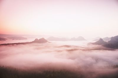 Scenic view of mountains against sky during sunset