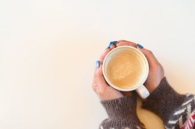 Close-up of coffee cup against white background