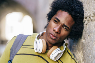 Close-up of thoughtful man with headphones