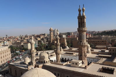 Panoramic view of buildings in city against sky