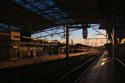 Railroad station platform at sunset