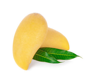 Close-up of lemon against white background