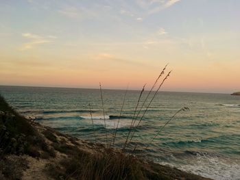 Scenic view of sea against sky during sunset