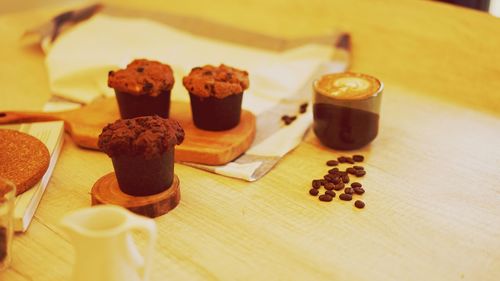 Coffee and cakes on table