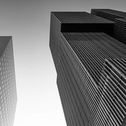 Low angle view of modern buildings against clear sky