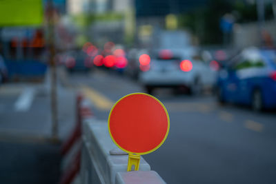 Close-up of road sign on street