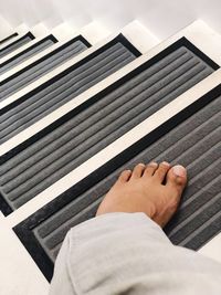 Low section of man relaxing on floor